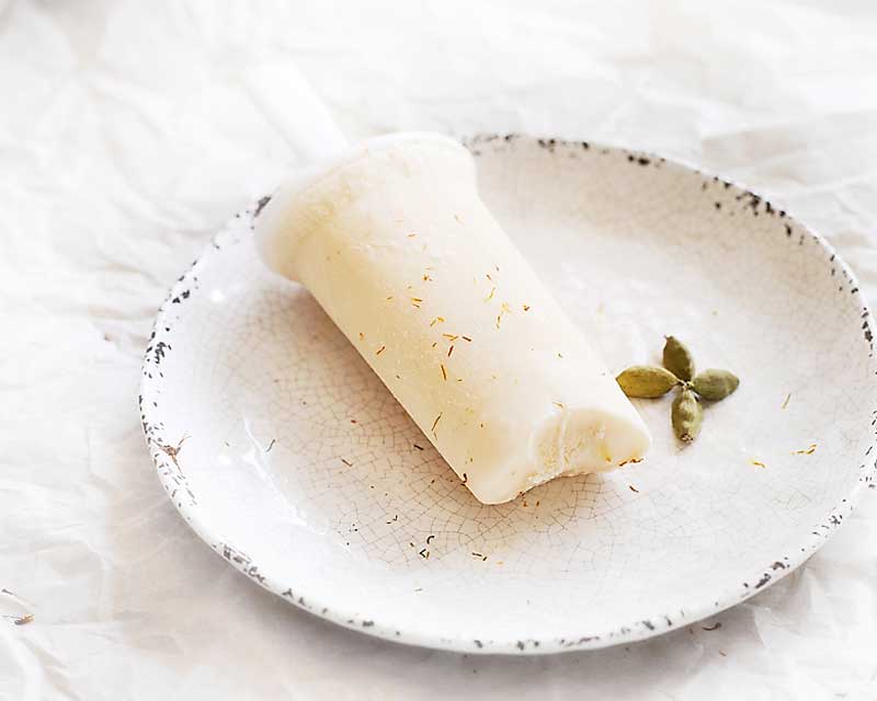 These frozen yogurt kulfi pops are a delicious, gluten free treat! With incredible Indian spices, you'll love these tasty frozen treats! gluten free popsicle
