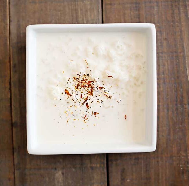 Rice Kheer is a rice pudding made with milk, cardamom, and saffron.  It's so simple, yet incredibly tasty.  You can serve it warm or cold too so its pretty versatile. Indian recipe, Indian dessert recipe, rice kheer