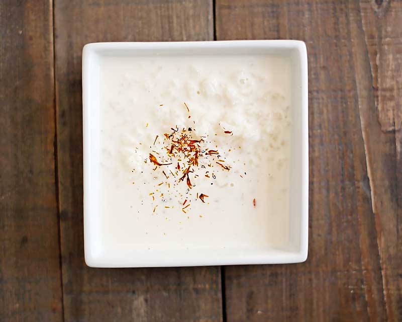 Rice Kheer is a rice pudding made with milk, cardamom, and saffron.  It's so simple, yet incredibly tasty.  You can serve it warm or cold too so its pretty versatile. Indian recipe, Indian dessert recipe, rice kheer