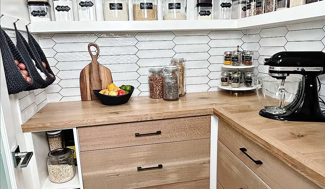 This timeless pantry with gorgeous floating shelves and a wood countertop is made even more functional with gorgeous crochet hanging baskets for simple and beautiful pantry organization. This pantry idea is both stunning and functional! #pantryidea, pantry organization, pantry idea, crochet patterns, free crochet pattern, crochet hanging basket, pantry idea, pantry design, floating shelves, how to build floating shelves, shelves, DIY shelves, wall shelves